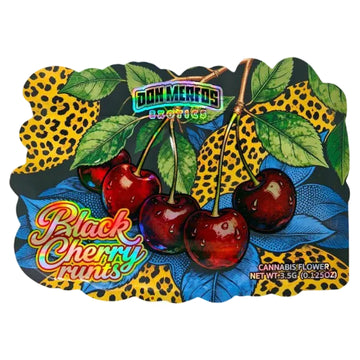 A decorative product label or packaging graphic for Don Mertos Crafers Black Cherry Runs cannabis flower, featuring illustrated cherries, green leaves, leopard-print patterns, and blue leaves on a dark background.